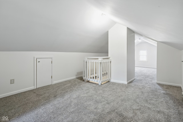 911 W Washington Ave, Shelbyville, IN 46176 - additional living space with baseboards, carpet, and lofted ceiling