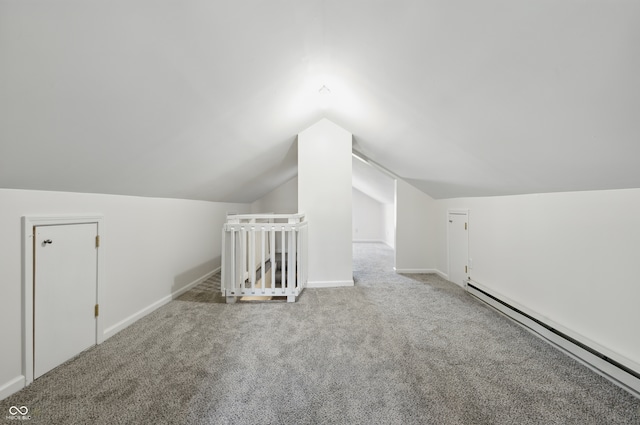 911 W Washington Ave, Shelbyville, IN 46176 - bonus room with baseboards, a baseboard heating unit, carpet floors, and vaulted ceiling