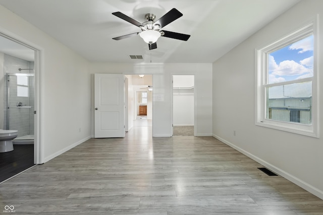 911 W Washington Ave, Shelbyville, IN 46176 - unfurnished bedroom with visible vents, multiple windows, and baseboards