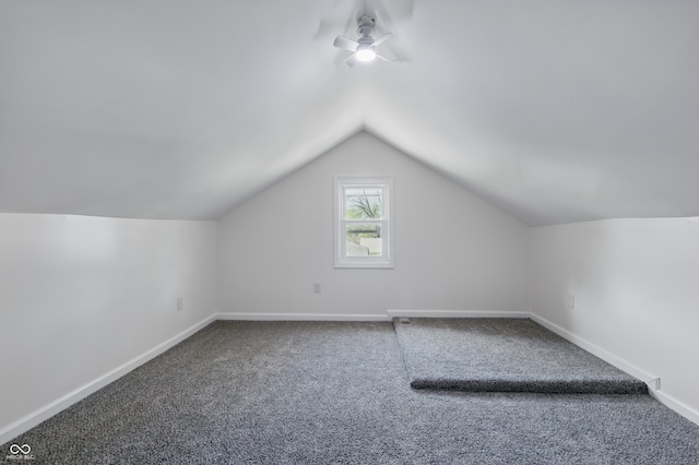 911 W Washington Ave, Shelbyville, IN 46176 - additional living space featuring a ceiling fan, vaulted ceiling, carpet floors, and baseboards