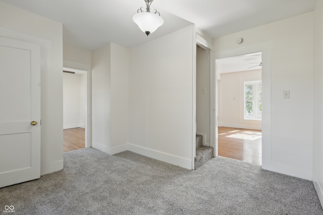 911 W Washington Ave, Shelbyville, IN 46176 - carpeted spare room with stairs and baseboards