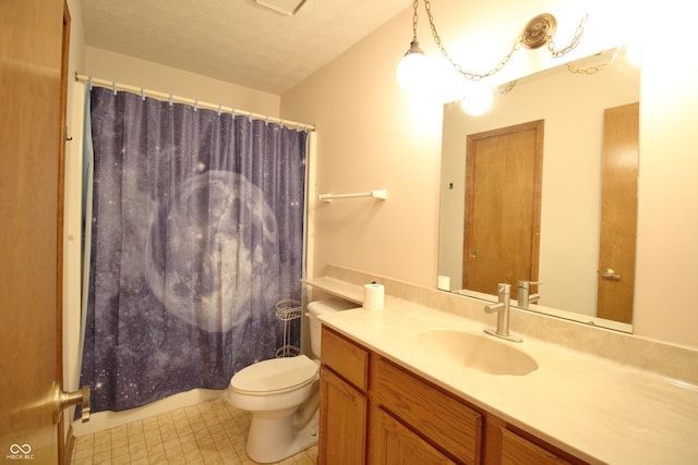 bathroom with tile patterned floors, toilet, vanity, and a shower with curtain