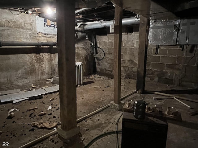 unfinished below grade area with radiator heating unit