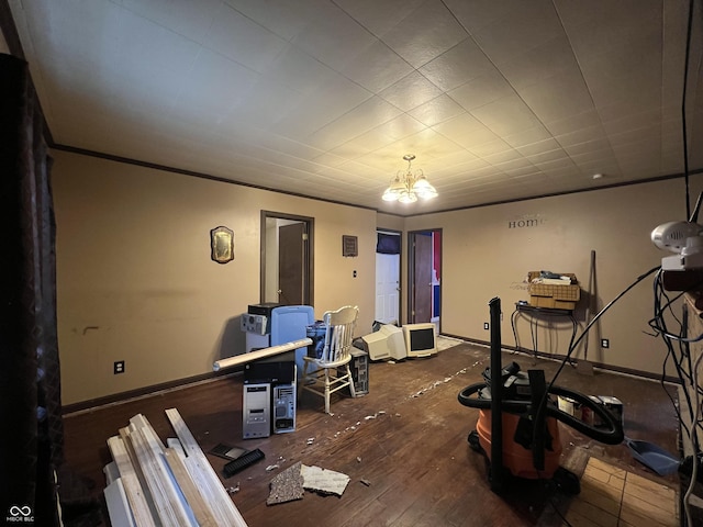 interior space with wood-type flooring, a chandelier, and baseboards