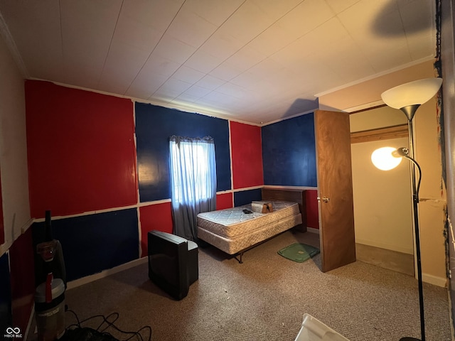 bedroom featuring crown molding and carpet floors