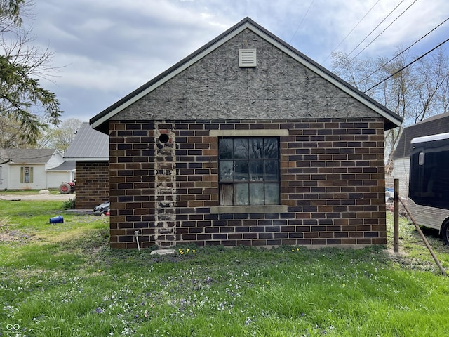 view of property exterior with a lawn