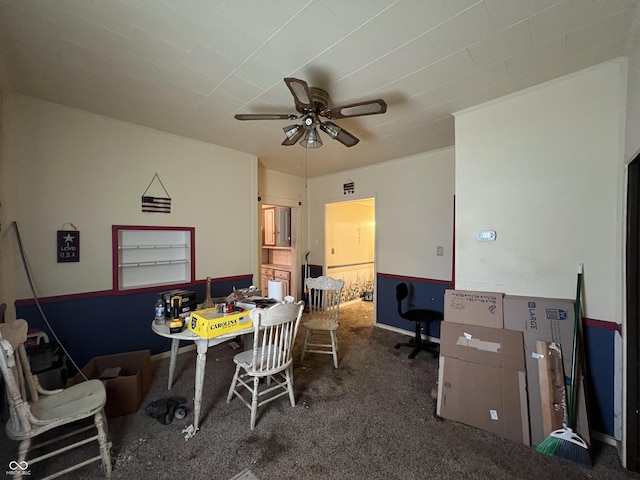 dining area featuring carpet, ceiling fan, and baseboards