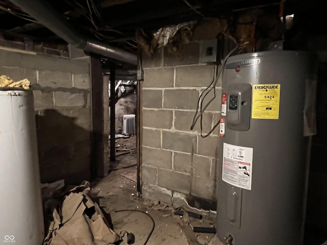 utilities with gas water heater, water heater, and radiator