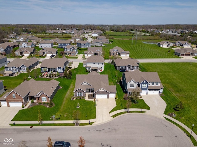 bird's eye view featuring a residential view and a water view