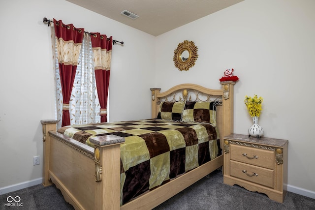 bedroom with carpet, visible vents, and baseboards