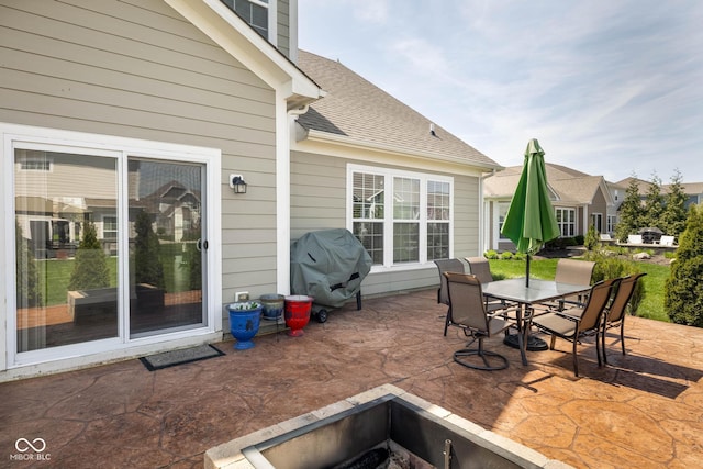 view of patio with grilling area and outdoor dining area