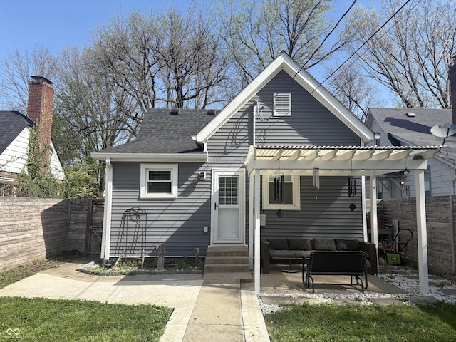 back of house with a pergola, fence, an outdoor hangout area, and entry steps