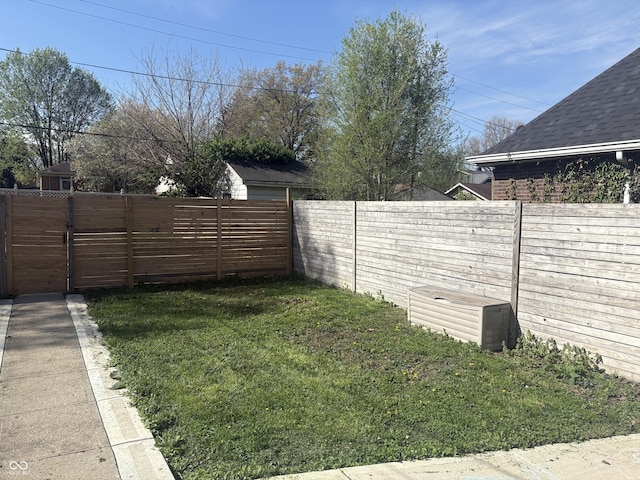 view of yard with a fenced backyard