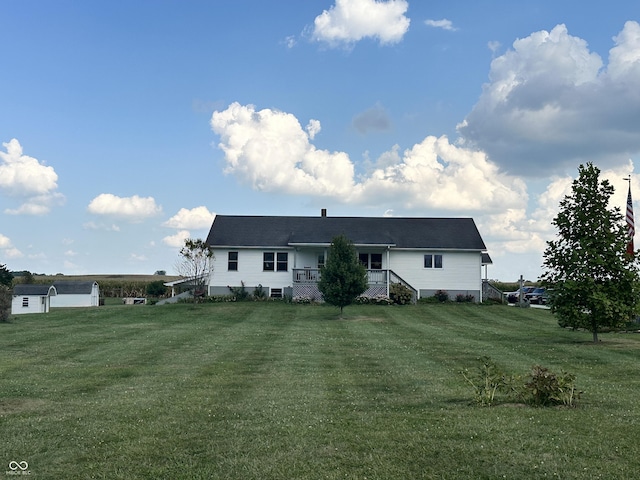 rear view of house with a lawn