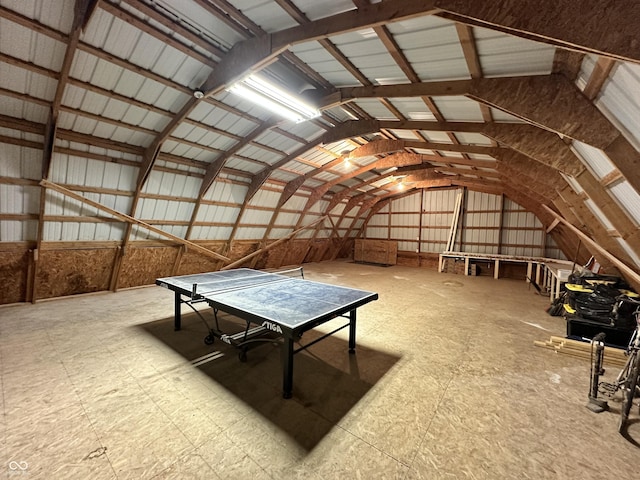 interior space with lofted ceiling and tile patterned floors