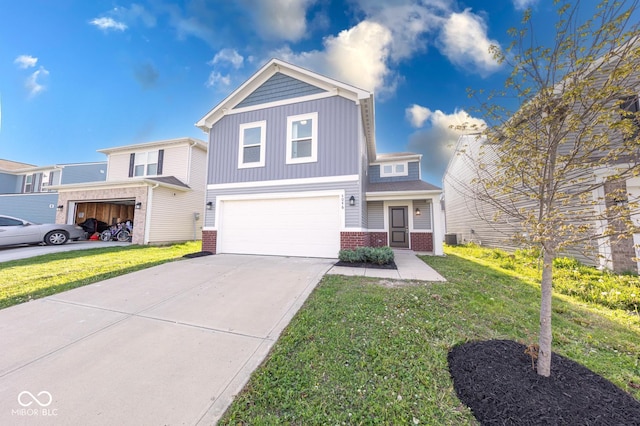 traditional-style house with an attached garage, a front lawn, brick siding, and concrete driveway