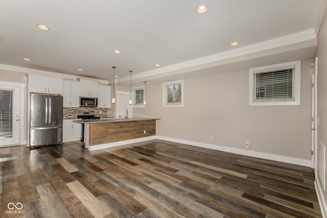4077 Rookwood Ave, Indianapolis, IN 46208 - kitchen with recessed lighting, stainless steel appliances, baseboards, white cabinets, and dark wood finished floors