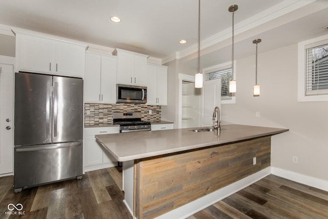 4077 Rookwood Ave, Indianapolis, IN 46208 - kitchen with appliances with stainless steel finishes, backsplash, dark wood-style floors, and a sink