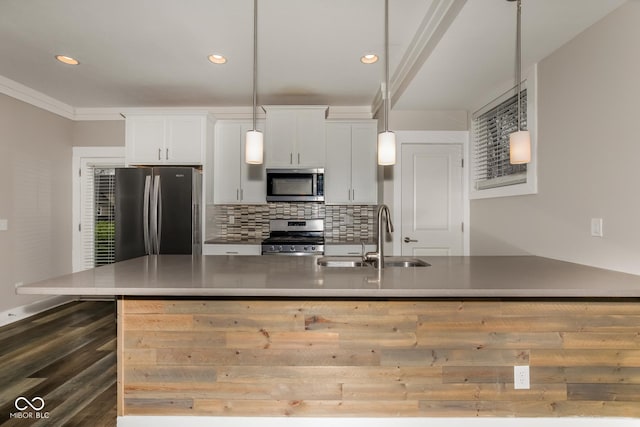 4077 Rookwood Ave, Indianapolis, IN 46208 - kitchen with white cabinets, a sink, stainless steel appliances, dark wood finished floors, and backsplash