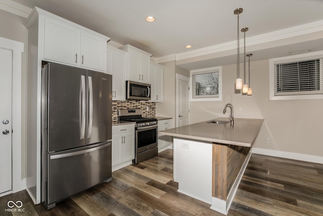 4077 Rookwood Ave, Indianapolis, IN 46208 - kitchen with recessed lighting, dark wood-style flooring, white cabinets, and stainless steel appliances