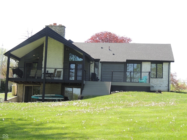 282 W Santee Dr, Greensburg, IN 47240 - rear view of house with a yard, a chimney, a shingled roof, and a sunroom