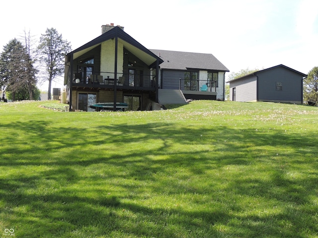 282 W Santee Dr, Greensburg, IN 47240 - back of house featuring a chimney, a yard, and a deck