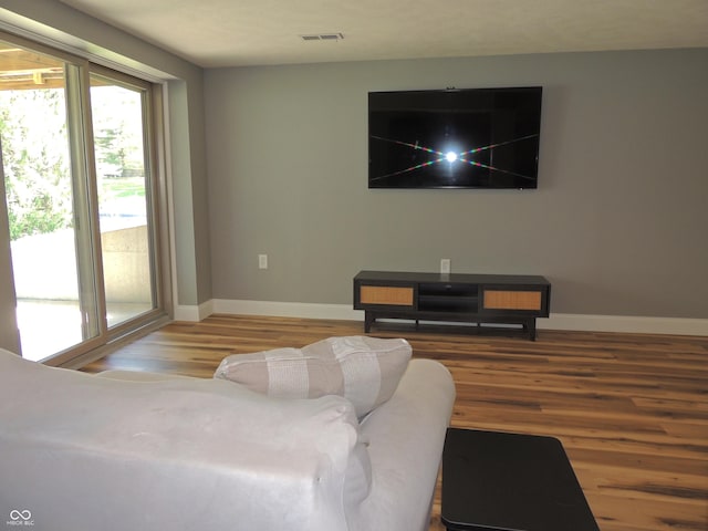 282 W Santee Dr, Greensburg, IN 47240 - living area with wood finished floors, baseboards, and plenty of natural light