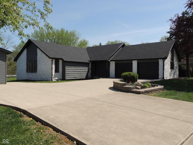 282 W Santee Dr, Greensburg, IN 47240 - view of front of house with concrete driveway, roof with shingles, and a garage