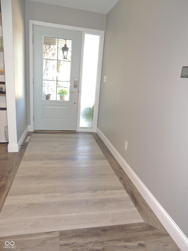 282 W Santee Dr, Greensburg, IN 47240 - doorway with baseboards and wood finished floors