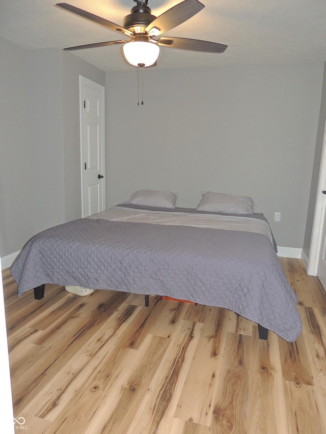 282 W Santee Dr, Greensburg, IN 47240 - bedroom featuring light wood-type flooring, baseboards, and ceiling fan