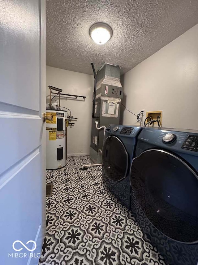 7833 Broadview Dr, Indianapolis, IN 46227 - laundry room with water heater, tile patterned floors, heating unit, laundry area, and washing machine and dryer