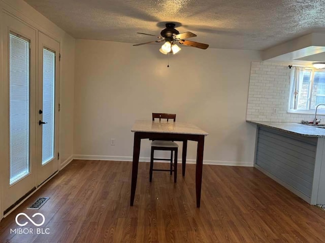 7833 Broadview Dr, Indianapolis, IN 46227 - unfurnished dining area with wood finished floors, visible vents, a textured ceiling, and ceiling fan