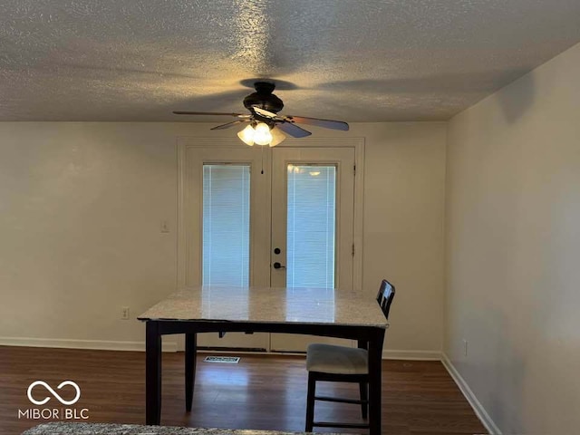 7833 Broadview Dr, Indianapolis, IN 46227 - dining room featuring dark wood finished floors, a ceiling fan, and a textured ceiling