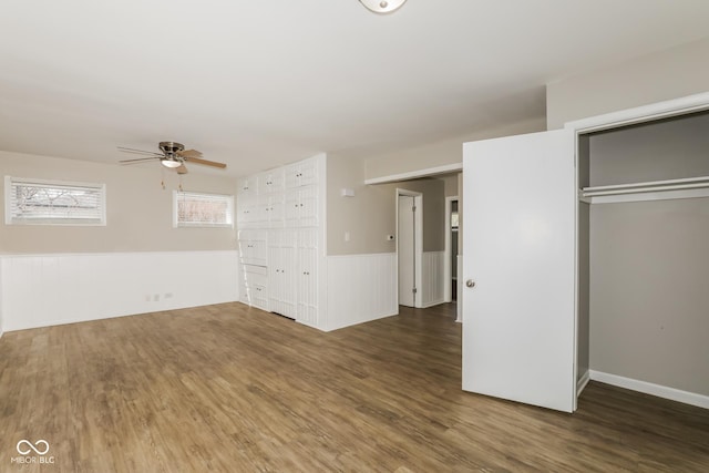 9535 E Michigan St, Indianapolis, IN 46229 - unfurnished living room featuring ceiling fan, wainscoting, and wood finished floors