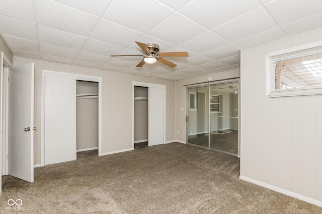 9535 E Michigan St, Indianapolis, IN 46229 - unfurnished bedroom with two closets, carpet flooring, and a paneled ceiling