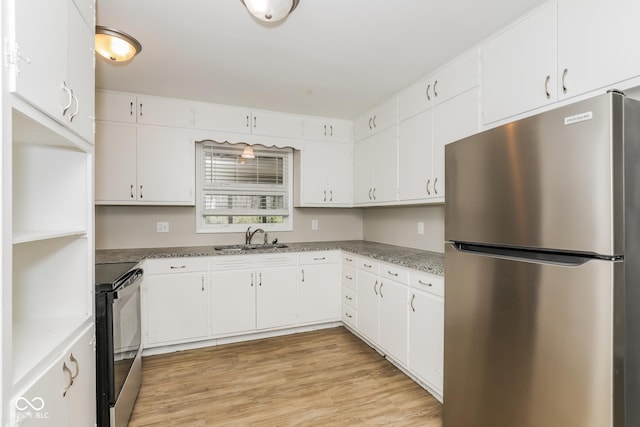 9535 E Michigan St, Indianapolis, IN 46229 - kitchen featuring appliances with stainless steel finishes, light wood-style flooring, white cabinets, and a sink