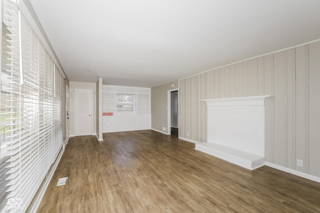 9535 E Michigan St, Indianapolis, IN 46229 - unfurnished living room with baseboards and wood finished floors