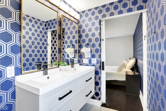 11626 Forest Dr, Carmel, IN 46033 - ensuite bathroom with wallpapered walls and double vanity