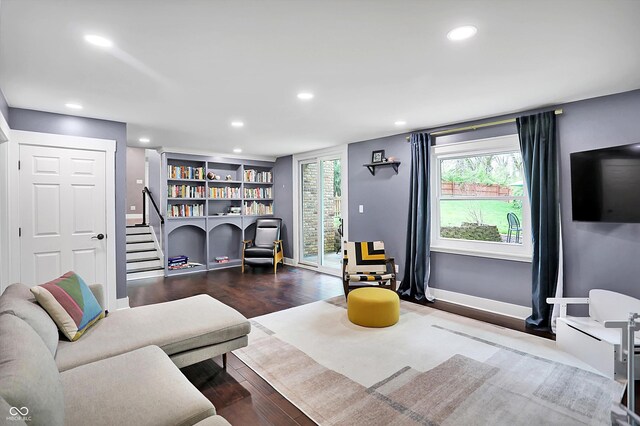 11626 Forest Dr, Carmel, IN 46033 - living area with wood finished floors, recessed lighting, stairway, baseboards, and built in shelves