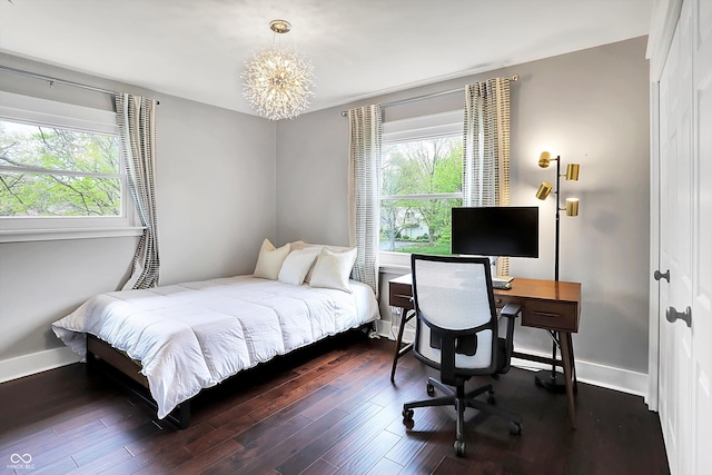 11626 Forest Dr, Carmel, IN 46033 - bedroom with multiple windows, a chandelier, and baseboards