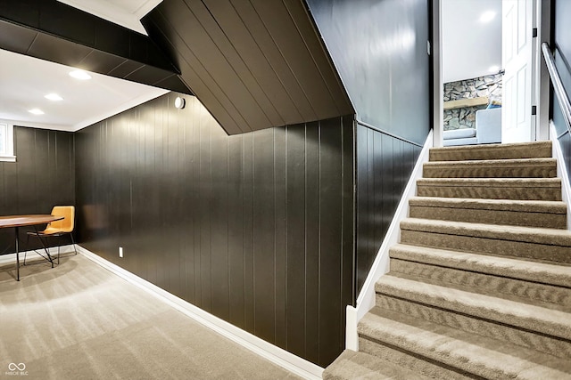 11626 Forest Dr, Carmel, IN 46033 - stairway featuring carpet floors, wood walls, baseboards, and recessed lighting