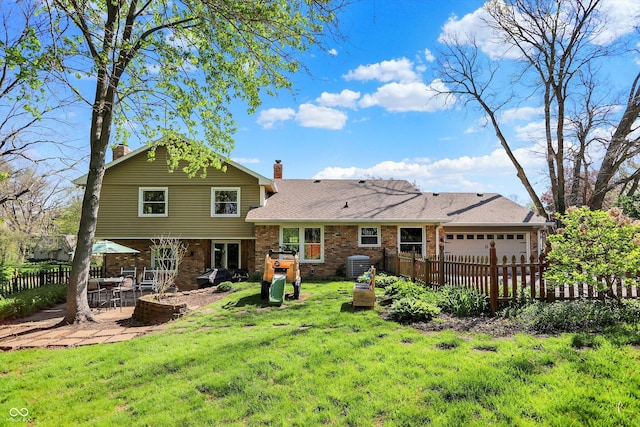 11626 Forest Dr, Carmel, IN 46033 - back of house with a chimney, a garage, central AC unit, brick siding, and a patio