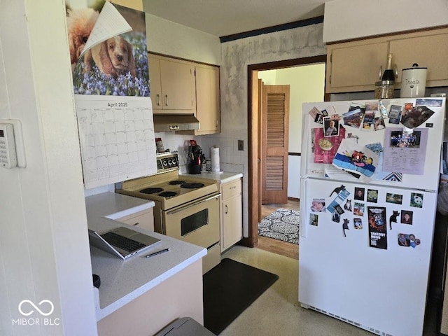 8230 E 11th St, Indianapolis, IN 46219 - kitchen featuring decorative backsplash, white appliances, light countertops, under cabinet range hood, and cream cabinets