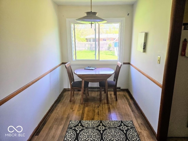 8230 E 11th St, Indianapolis, IN 46219 - dining room featuring dark wood finished floors and baseboards