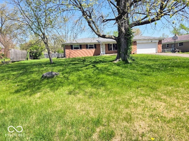 8230 E 11th St, Indianapolis, IN 46219 - ranch-style home with a front lawn, driveway, an attached garage, fence, and brick siding