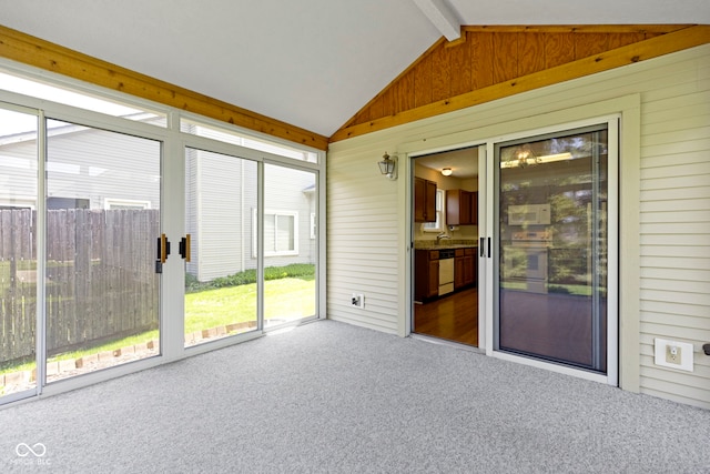 unfurnished sunroom with a sink and beam ceiling