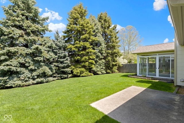 view of yard with fence and a patio area