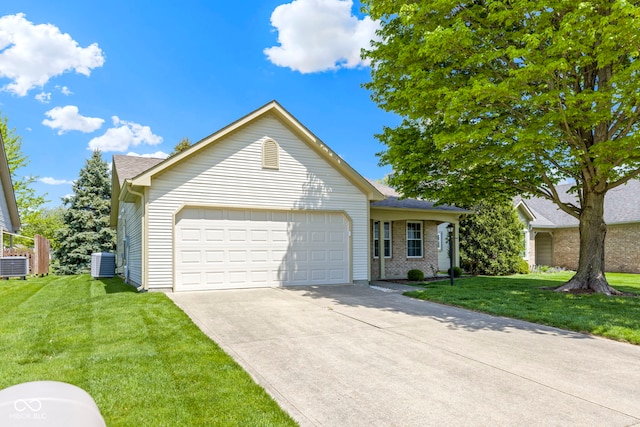 view of front of house with central AC, driveway, a front lawn, and a garage