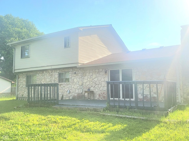 7108 Hearthstone Way, Indianapolis, IN 46227 - rear view of house featuring stone siding, a yard, and a deck