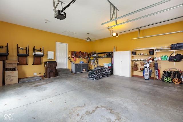 garage featuring a garage door opener and a workshop area